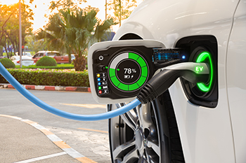 5 things to think about when buying an electric vehicle. An EV being charged outside.