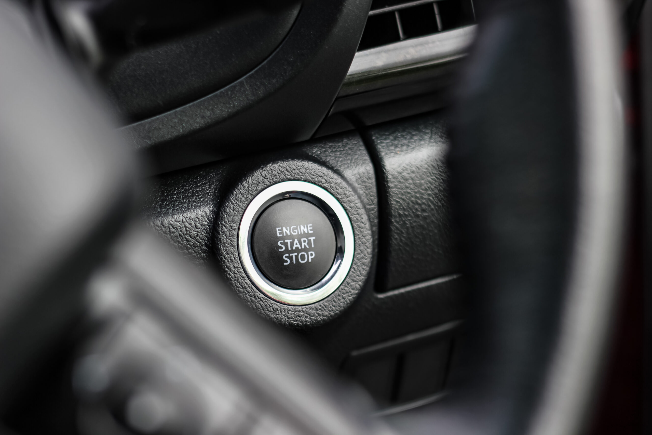 Close up engine car start button. 