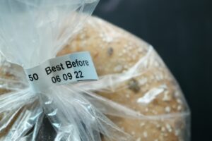 A bag of bread with a best before date label
