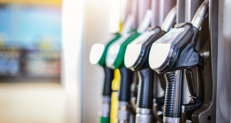 Colorfull fuel gasoline dispenser background. Fuel pumps station close up, copy space.