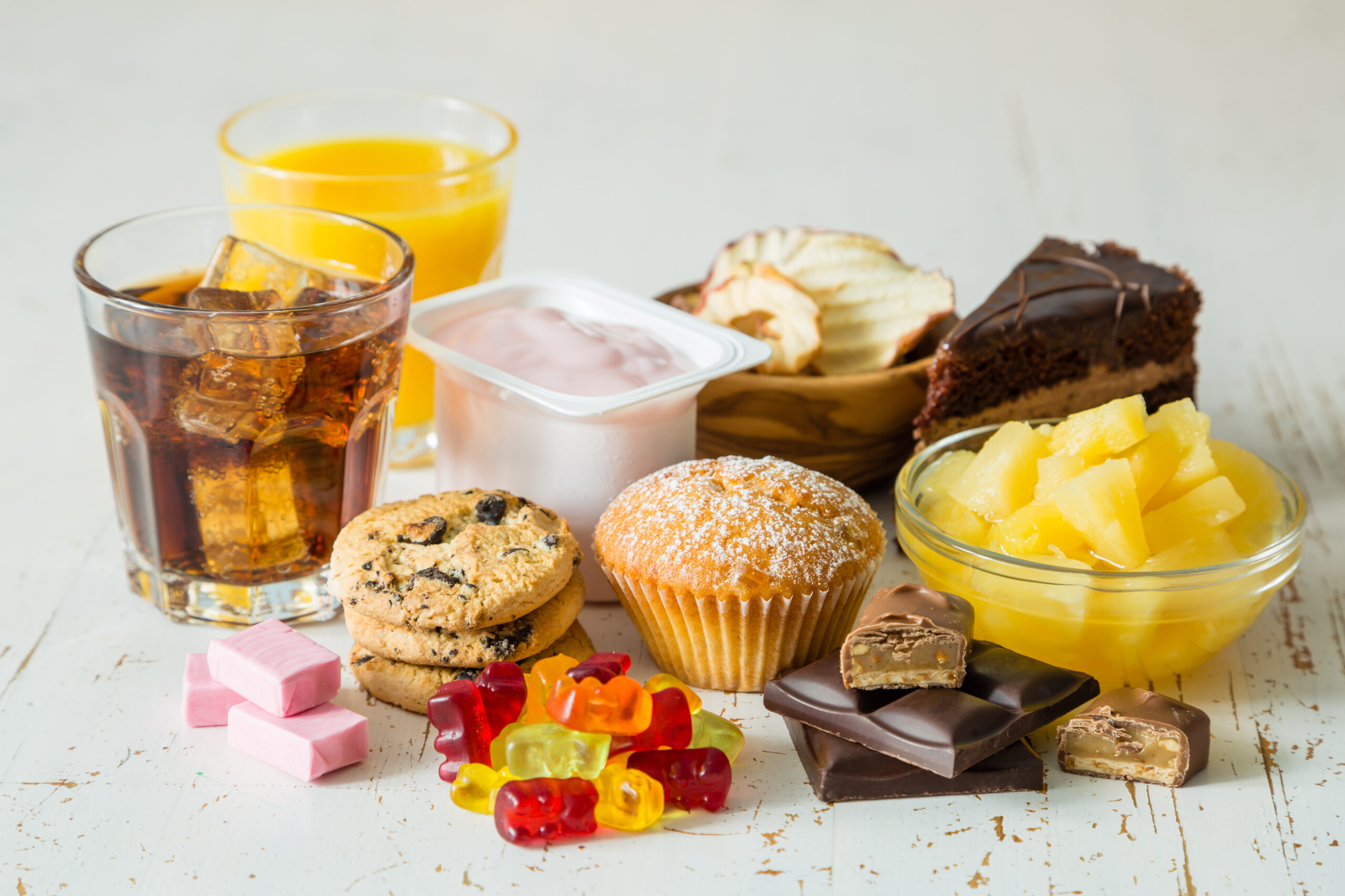 Selection of food high in sugar, copy space