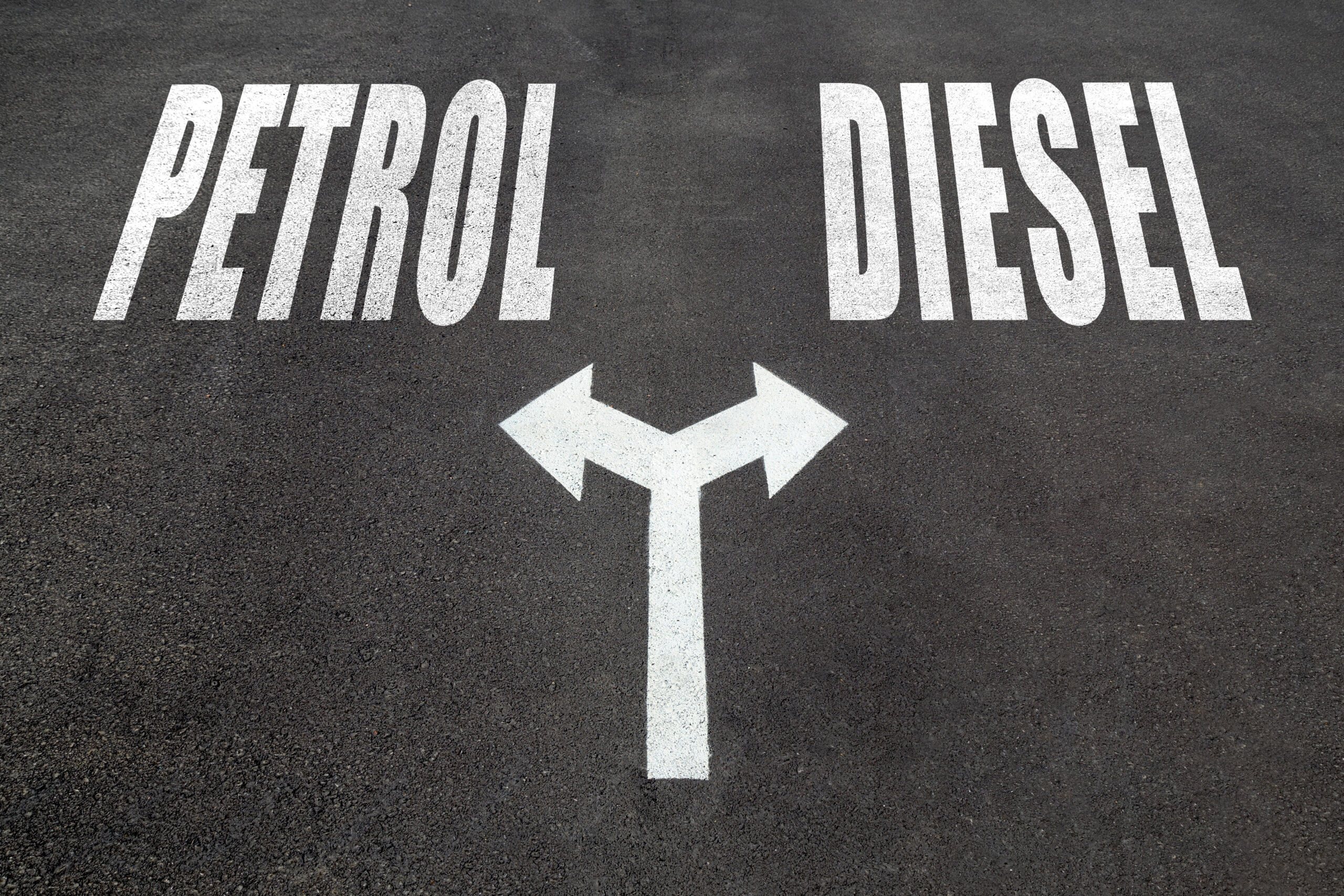 Petrol vs diesel choice concept, two direction arrows on asphalt.