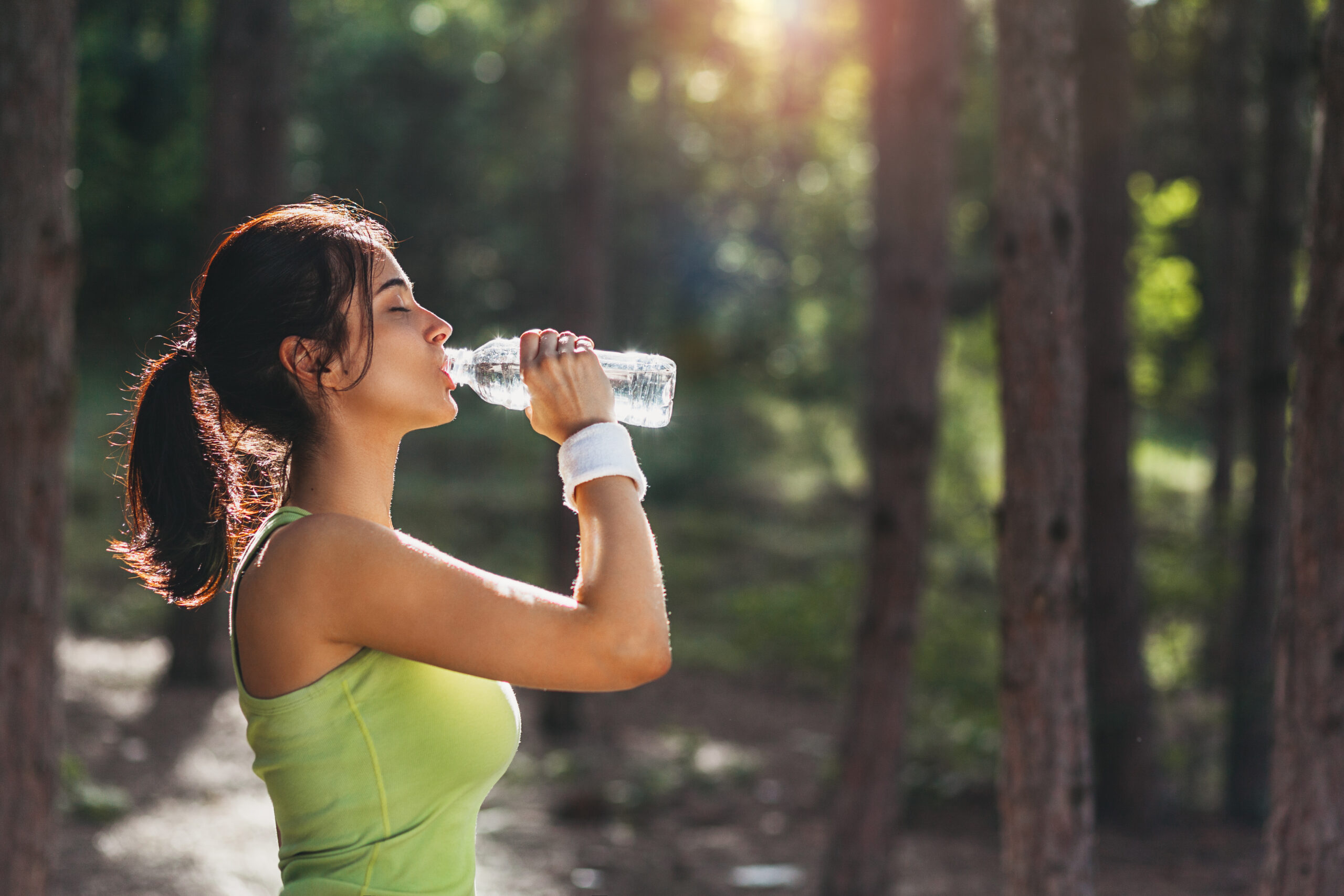 Woman drinking water to keep hydrated