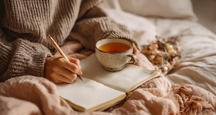 Woman writing in journal