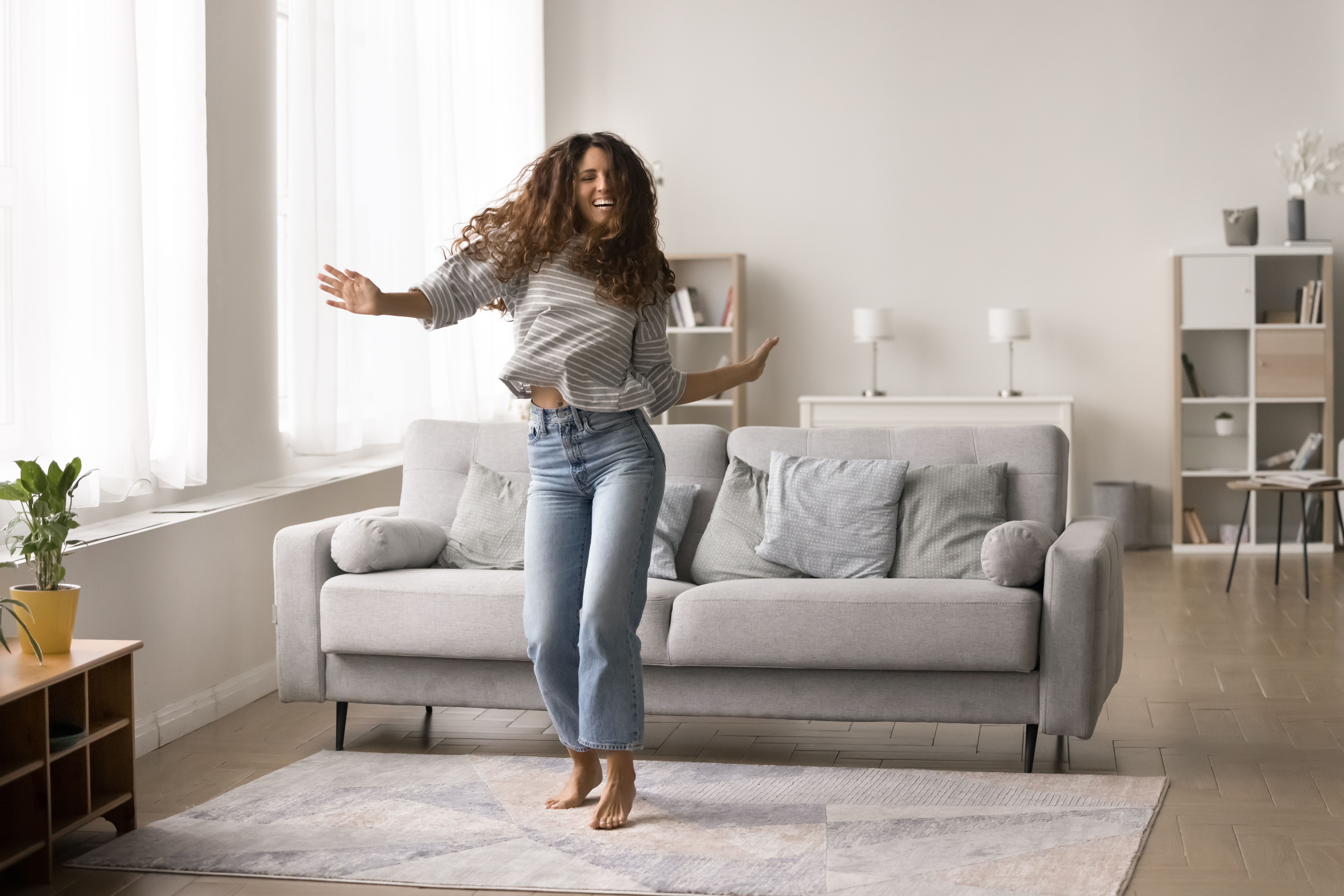 Woman dancing in her living room