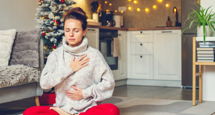 Woman doing breathing exercises at Christmas