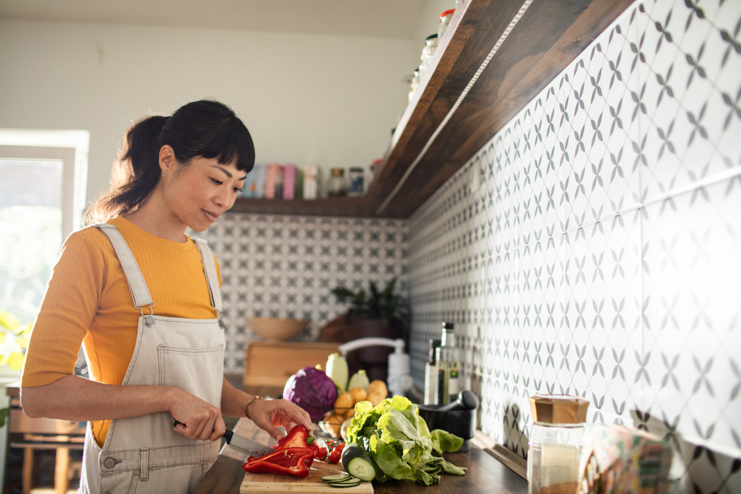 Woman cooking with healthy ingredients