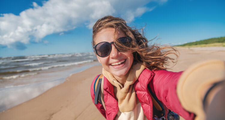 Woman walking on the beach during Spring time